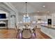 Bright dining area with stone fireplace and ample seating perfect for entertaining at 1668 Legrand Cir, Lawrenceville, GA 30043