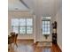 Welcoming entryway featuring hardwood floors, a decorative rug, and a charming front door with a window at 1668 Legrand Cir, Lawrenceville, GA 30043