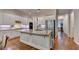 Modern kitchen with granite countertops, stainless steel appliances, and hardwood floors, perfect for cooking at 1668 Legrand Cir, Lawrenceville, GA 30043