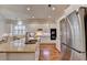 Bright kitchen with stainless steel fridge and appliances, granite counters, and an open layout for gathering at 1668 Legrand Cir, Lawrenceville, GA 30043