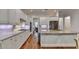 Gourmet kitchen featuring granite countertops, stainless steel appliances, and custom cabinets, perfect for chefs at 1668 Legrand Cir, Lawrenceville, GA 30043