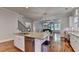 Modern kitchen features an island with granite countertops and stainless steel appliances at 1668 Legrand Cir, Lawrenceville, GA 30043