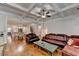 Open living room features coffered ceilings, hardwood floors and easy access to kitchen at 1668 Legrand Cir, Lawrenceville, GA 30043