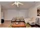 Sitting area with a leafy patterned rug, four chairs and a ceiling fan at 1668 Legrand Cir, Lawrenceville, GA 30043