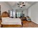 Spacious main bedroom features hardwood floors, tray ceiling, and window at 1668 Legrand Cir, Lawrenceville, GA 30043