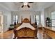 Spacious main bedroom features hardwood floors, tray ceiling, and abundant light at 1668 Legrand Cir, Lawrenceville, GA 30043