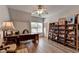 Office with ceiling fan, hardwood flooring and built-in shelves at 1668 Legrand Cir, Lawrenceville, GA 30043