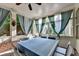 Covered patio with brick flooring, columns, curtains, and outdoor seating at 1668 Legrand Cir, Lawrenceville, GA 30043
