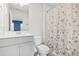 Bathroom with a shower and tub combination with a floral curtain and white vanity at 3641 Princeton Ave, Atlanta, GA 30337