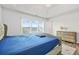 Well-lit bedroom with tray ceiling, large window, and coordinated furniture at 3641 Princeton Ave, Atlanta, GA 30337