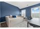Bedroom with blue accent wall, carpet, a daybed, and natural light at 3641 Princeton Ave, Atlanta, GA 30337