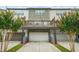Townhome with garages on the first level and outdoor patios on the second level at 3641 Princeton Ave, Atlanta, GA 30337