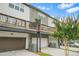 Townhome with garages on the first level and outdoor patios on the second level at 3641 Princeton Ave, Atlanta, GA 30337