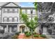 Charming townhome with landscaped front yard and brick-paved walkway to the front door at 3641 Princeton Ave, Atlanta, GA 30337