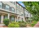 Attractive townhome with manicured landscaping, a small balcony, and brick accents at 3641 Princeton Ave, Atlanta, GA 30337