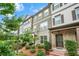 Beautiful townhome with lush landscaping, a brick facade, and a welcoming entrance at 3641 Princeton Ave, Atlanta, GA 30337