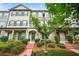 Charming townhome with landscaped front yard and brick-paved walkway to the front door at 3641 Princeton Ave, Atlanta, GA 30337