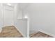 Bright hallway with wood-look flooring leading to a white door, freshly painted at 3641 Princeton Ave, Atlanta, GA 30337