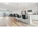 Open-concept kitchen featuring stainless steel appliances and a breakfast bar connecting to the dining area at 3641 Princeton Ave, Atlanta, GA 30337