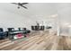 Spacious living room with modern furnishings, open floor plan, and wood-look flooring at 3641 Princeton Ave, Atlanta, GA 30337