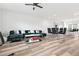 Open-concept living area with a modern kitchen, dining area, and comfortable lounge space at 3641 Princeton Ave, Atlanta, GA 30337