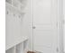 Convenient mudroom with built-in bench, storage shelves, and coat hooks at 3641 Princeton Ave, Atlanta, GA 30337