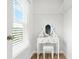 Walk-in closet with a vanity, natural light from the window and wood flooring at 3641 Princeton Ave, Atlanta, GA 30337