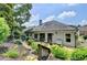 Exterior of home with patio featuring an outdoor seating area, steps, lush greenery, and manicured landscaping at 510 Elgaen Ct, Roswell, GA 30075