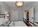 Charming bedroom showcasing a closet with bifold doors, neutral wall paint, and an open doorway at 510 Elgaen Ct, Roswell, GA 30075