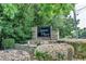 Stone community sign, 'Elgaen Place', surrounded by manicured bushes and mature trees at 510 Elgaen Ct, Roswell, GA 30075