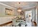 Dining room with chandelier, wainscoting, and access to additional living space at 510 Elgaen Ct, Roswell, GA 30075
