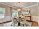 Charming dining room with elegant chandelier and natural light from window at 510 Elgaen Ct, Roswell, GA 30075