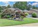 Beautiful brick home featuring mature trees, a well-kept lawn, and an attached two-car garage at 510 Elgaen Ct, Roswell, GA 30075