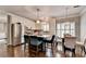 Bright kitchen featuring white cabinets, stainless steel appliances, and eat-in island at 510 Elgaen Ct, Roswell, GA 30075