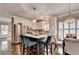 Bright kitchen featuring white cabinets, stainless steel appliances, and eat-in island at 510 Elgaen Ct, Roswell, GA 30075