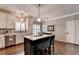 Modern kitchen featuring white cabinets, stainless steel appliances, and eat-in island at 510 Elgaen Ct, Roswell, GA 30075