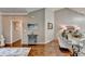 Open-concept living area with hardwood floors, neutral walls, and stylish furnishings at 510 Elgaen Ct, Roswell, GA 30075