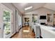 Sunlit living room with vaulted ceilings, fireplace, and an open layout at 510 Elgaen Ct, Roswell, GA 30075