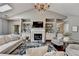 Sun-filled living room features a vaulted ceiling, fireplace, and comfortable seating at 510 Elgaen Ct, Roswell, GA 30075