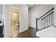 Modern bathroom featuring a glass enclosed shower and ceramic tile flooring with hallway access at 5504 Cameron Parc Dr, Alpharetta, GA 30022