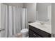 Clean bathroom features a shower with stylish striped curtain, toilet, and modern vanity at 5504 Cameron Parc Dr, Alpharetta, GA 30022
