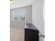 Bedroom featuring natural light and a dark wood dresser for ample storage at 5504 Cameron Parc Dr, Alpharetta, GA 30022