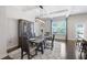 Elegant dining room with hardwood floors, modern light fixture, and comfortable seating creating a perfect space at 5504 Cameron Parc Dr, Alpharetta, GA 30022