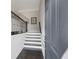 Entryway showcasing stairs with metal railing and dark wood floors leading upwards at 5504 Cameron Parc Dr, Alpharetta, GA 30022