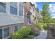 Charming brick townhome with manicured landscaping, inviting entrance and sunny curb appeal at 5504 Cameron Parc Dr, Alpharetta, GA 30022