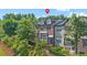 Beautiful brick townhome with well-maintained landscaping and mature trees in a desirable community at 5504 Cameron Parc Dr, Alpharetta, GA 30022