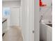 Light-filled hallway featuring laundry area with new washer and dryer at 5504 Cameron Parc Dr, Alpharetta, GA 30022