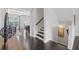 Inviting hallway with hardwood floors connecting to various rooms creating a seamless flow throughout the home at 5504 Cameron Parc Dr, Alpharetta, GA 30022