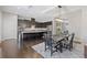 Open kitchen and dining area featuring dark wood cabinets and stainless steel appliances at 5504 Cameron Parc Dr, Alpharetta, GA 30022
