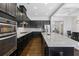 A well-appointed kitchen with stainless steel appliances, granite counters, and dark wood cabinets at 5504 Cameron Parc Dr, Alpharetta, GA 30022